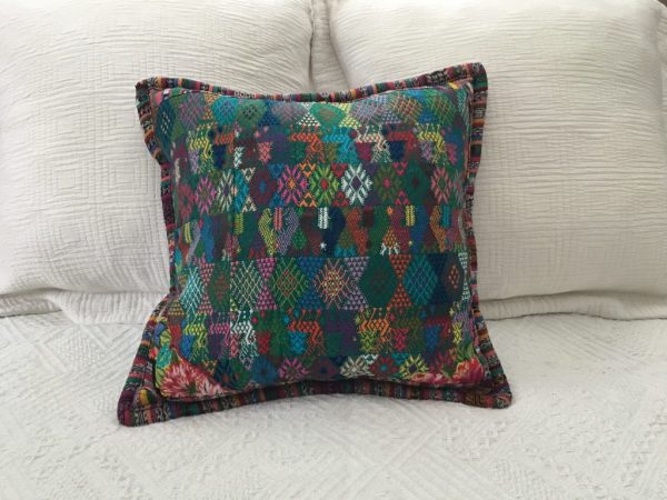 Guatemalan cushion in a teal color  |