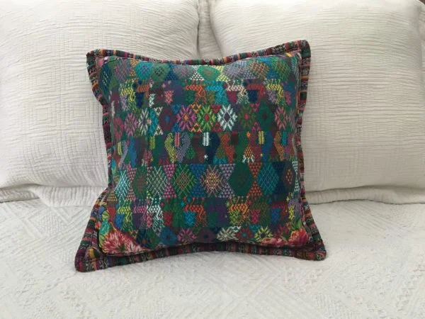 Guatemalan cushion in a teal color  |