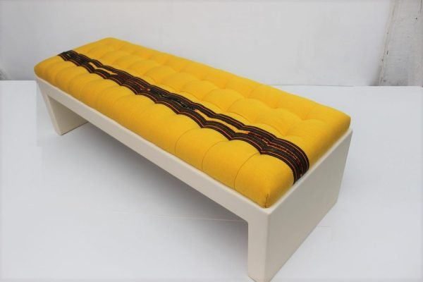 Custom made upholstered bench with lacquered base |