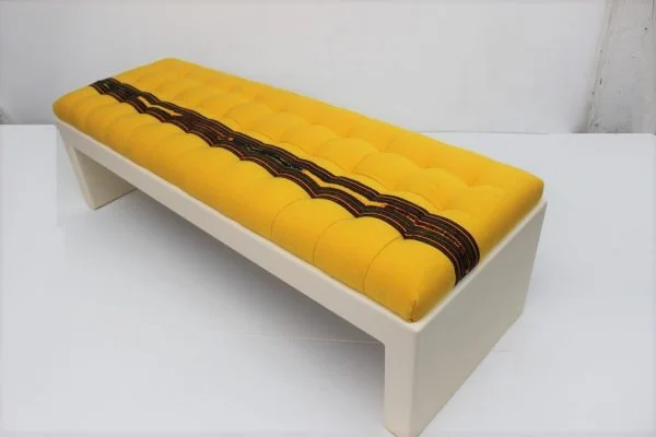Custom made upholstered bench with lacquered base |